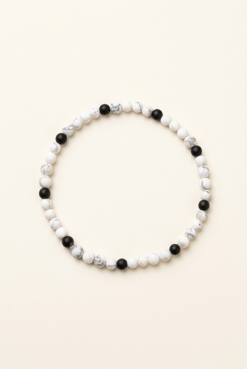 Howlite and black onyx bracelet on a warm ivory background