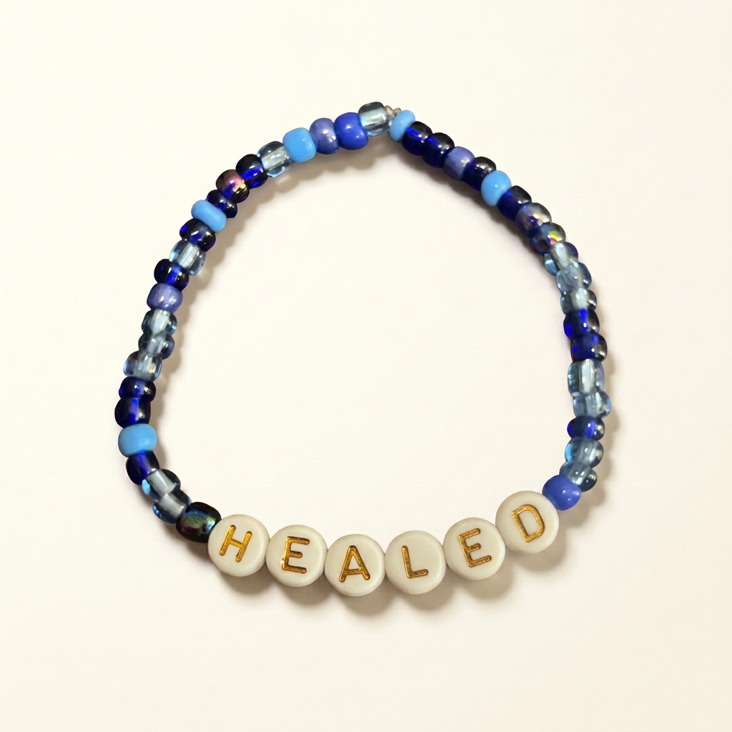 Healed blue seed bead bracelet on an ivory background