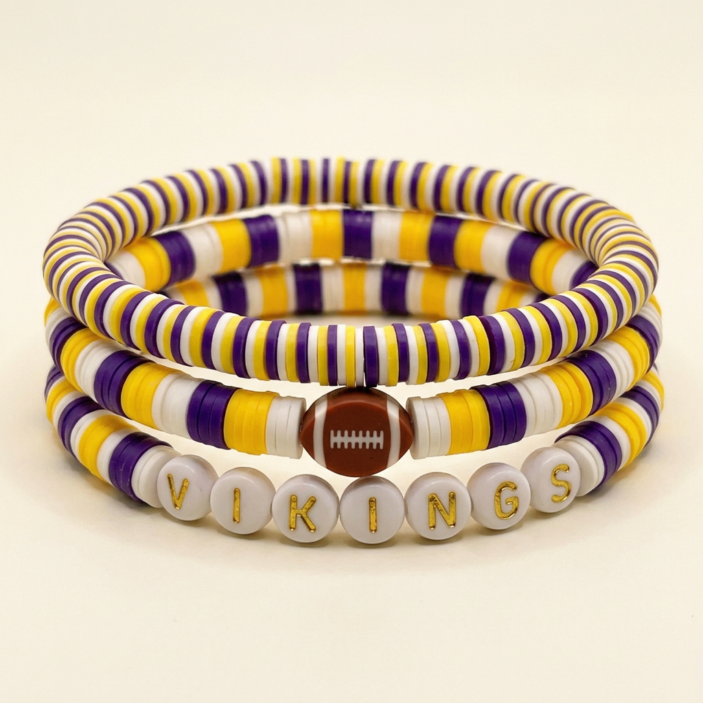 VIKINGS purple, yellow and white three-bracelet set arranged in a stack on a warm ivory background