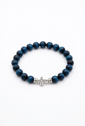 Aquamarine tiger eye bead bracelet with a silver cross on a white background