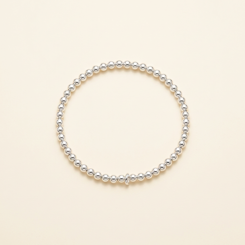 3 mm silver-plated bead bracelet on a warm ivory background