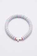 Pastel clay bead bracelet with a cross on a soft-white background