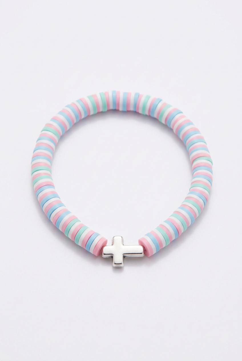 Pastel clay bead bracelet with a cross on a soft-white background