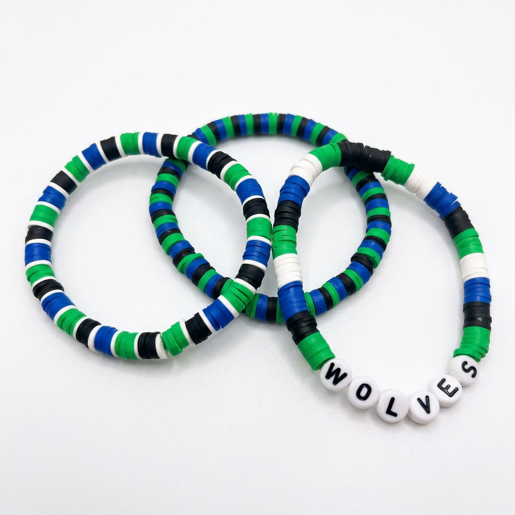Three green, blue, black, and white beaded bracelets, one with WOLVES letter beads, on a white background.