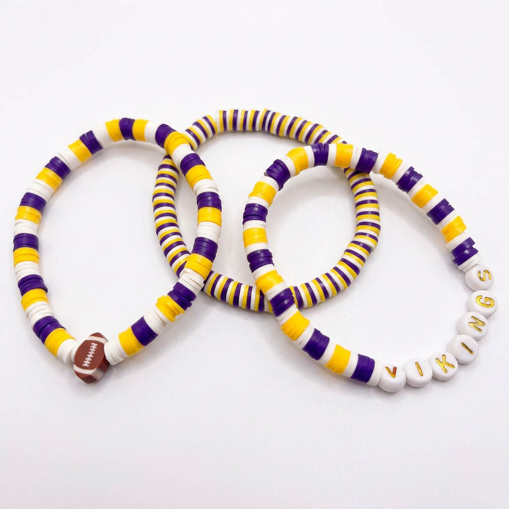 Three purple, yellow, and white beaded bracelets with a football accent and VIKINGS letter beads on a white background.